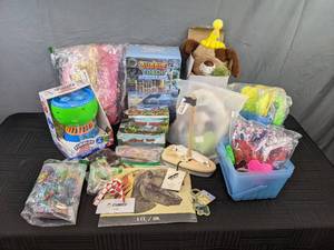 lot 162 image: Various Toys Including Bubble Blowers, Stuffed Dog, Wooden Sailboat, Animal Sets and More