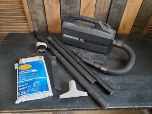 lot 96 image: ORECK XL HandHeld Vaccum Cleaner with Attatchments