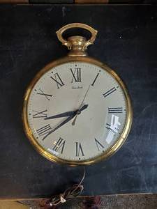 lot 79 image: United Clock Corp Large Pocket Watch Wall Clock