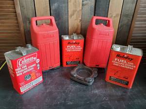 lot 81 image: 2 Coleman Lantern Cases and vintage Fuel Cans