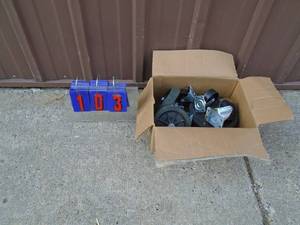 lot 103 image: Box of casters & wheels. As shown.