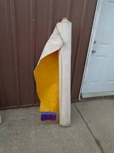 lot 104 image: Roll of yellow vinyl fabric 4 x 20 As shown.