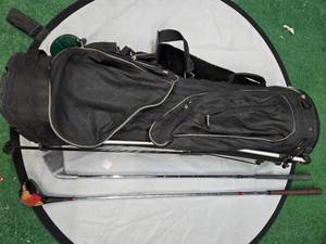 lot 74 image: Datrek Golf Bag with 2 Gold Clubs ( Used)