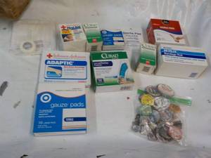 lot 12 image: Vintage Pins and Bandage Products...