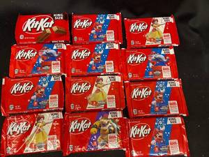 lot 92 image: T - Collection of 12 King Size Kit Kat Bars - Super Mario Edition