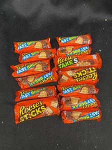lot 106 image: U - Collection of 12 Reeses Fast Break and Reeses Sticks Candy Bars
