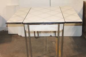 lot 15 image: Vintage Kitchen Table with Metal Legs and Leaf Extensions