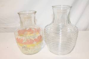 lot 30 image: Set of 2 Glass Beverage Containers or Vases, one with Floral Design and one with Ribbed Texture