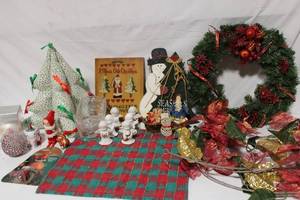 lot 228 image: Christmas Decorative Collection with Wreaths, Santa Figurines, and Ornaments