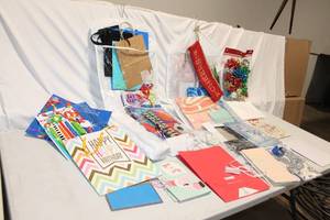 lot 324 image: Assorted Gift Bags, Wrapping Paper, and Decorative Bows Collection