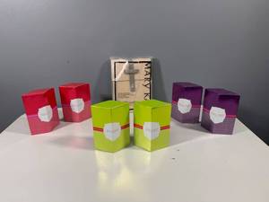 lot 15 image: Set of 4 Mary Kay Fragrance Sets with Leather Bag