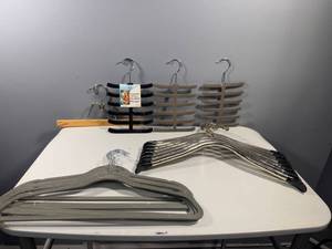 lot 29 image: Set of Assorted Hangers - Velvet, Metal, and Wooden with TieBelt Hangers
