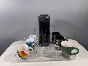 lot 39 image: Collection of 6 Unique Coffee Mugs, Black Aladdin Coffee Carafe, Beverage Tray and Glass Candy Dish