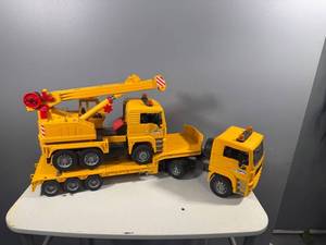 lot 61 image: Bruder MAN TGA 41440 Truck with Crane and Flatbed Trailer