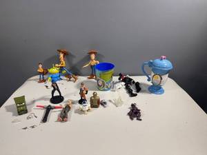 lot 68 image: Assorted Toy Character Figures and Cup - Toy Story & Star Wars Themes
