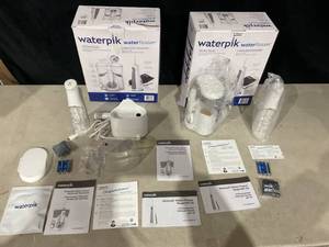 lot 381 image: LOT OF 2 Waterpik Ultra Plus and Cordless Freedom Water Flosser
