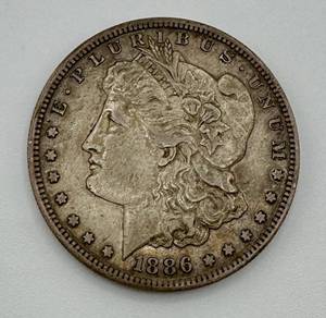 lot 167 image: 1886 S Morgan Silver Dollar