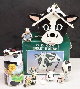 lot 51 image: Cow Birdhouse, Tin Milk Can Chupa Chupys and Miniatures