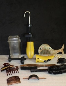 lot 66 image: Vintage Vanity Dresser Hair Accessories Shoe Horn Hanger Stanley Lint Brush Whale Comb Fish Brush Otter Box Etc