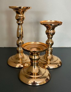 lot 126 image: Set of Three Elegant Brass Candle Holders