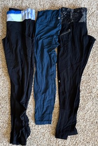 lot 72 image: Three Pairs of Lulu Lemon Leggings in Navy, Black and Black with White & Blue Stripes
