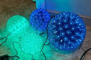 lot 280 image: Four Blue and Green Light Up Balls