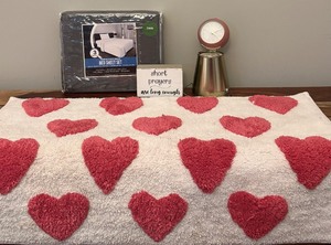 lot 493 image: Fun Variety including Hearts Bath Rug, Sign, Small Bucket, Sheets and More