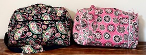 lot 391 image: Two Beautiful Overnight Bags by Vera Bradley  Black with Paisley and Pink with Geometric Flowers