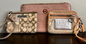 lot 164 image: Two Coach Wristlets and a Michael Kors Wristlet