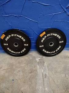 lot 23 image: (2) Rep Fitness 15lb Bumper Plates