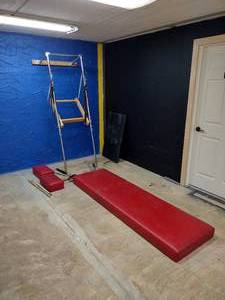 lot 65 image: Pilates wall tower equipment with mat