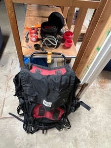 lot 76 image: REI backpackgear including Katadyn water purifier, Guyot nesting bowls, iGo charger, CRKT & Gerber knife,  Optimus Terra pans