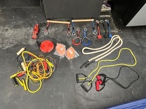 lot 84 image: Ninja Line Ratchet & NinjaLine accessories, Monkey Bar Obstacles, steel gym rings, bladders, jump ropes, Sterilite storage box