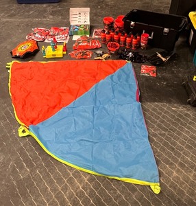 lot 89 image: Kids Ninja party accessories & Better Homes & Gardens parachute game