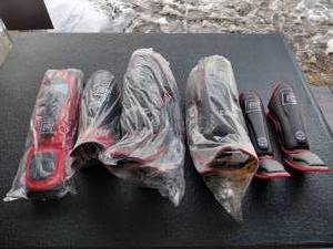 lot 145 image: Combat Corner CRNR gear Kids shin guards, Adult Elite Spar shin pads, MMA Shin Pads