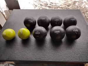 lot 155 image: (7) Series-8 fitness 10 lb medicine balls and (2) 6lb Tone Fitness medicine balls