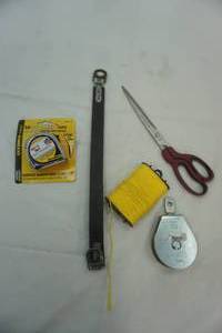 lot 64 image: 15 ft. tape measure, pulley-capacity 650 lbs. and other