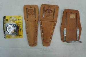 lot 67 image: Leather tool belt accessories and tape measure