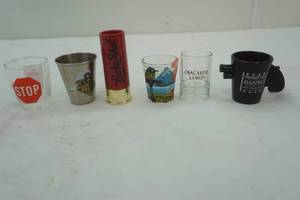 lot 90 image: Shot glass lot with 12 gauge shell