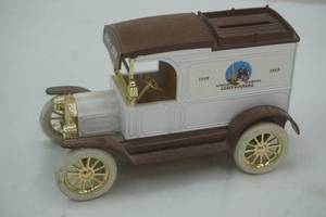 lot 124 image: Ertl 1913 Model T Van. Coin Bank with Key.