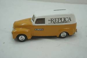 lot 127 image: Ertl The Replica Collectors Club News. Coin Bank with Key.