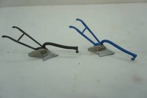 lot 136 image: Tractor Supply Co. One Bottom Plows. Collectors Corner