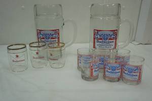 lot 254 image: Budweiser large mugs and small beer glasses