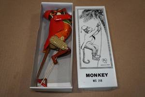 lot 142 image: Vintage Look Tin Litho Climbing Monkey