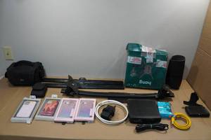 lot 303 image: Assorted Electronics - Wall Mounts, Phone Cases, Modems, Headphones
