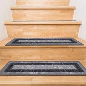 lot 44 image: Ottomanson Ottohome Collection Non-Slip Rubberback Bordered Design 8.5 in. x 26 in. Indoor Stair Tread Covers, Set of 7, GrayBlack Customer Returns See Pictures