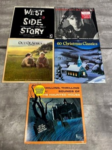 lot 22 image: Vinyl LP Lot - West Side StoryOut of AfricaEddie and The CruisersDisneyland The Haunted House60 Christmas Classics in Used Condition