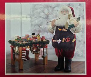 lot 37 image: Santa Claus Figurine with Toy Shop Bench Decor