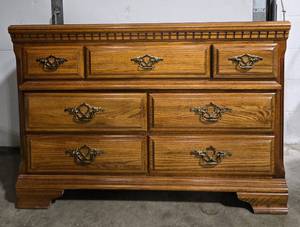 lot 52 image: Classic Oak Dresser with Six Drawers and Decorative Hardware