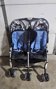 lot 59 image: Combi Twin Double Stroller in Blue and Black
